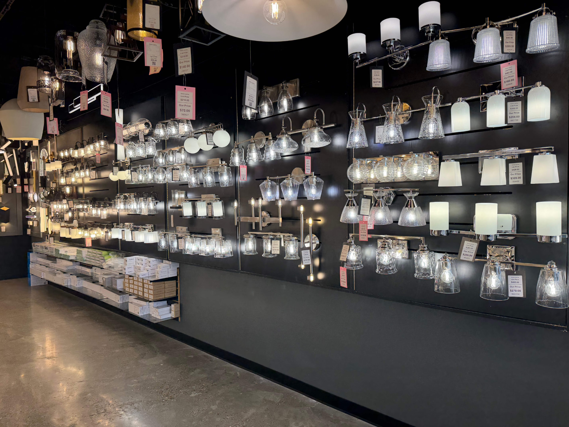 Chandeliers and ceiling lights illuminated in the showroom