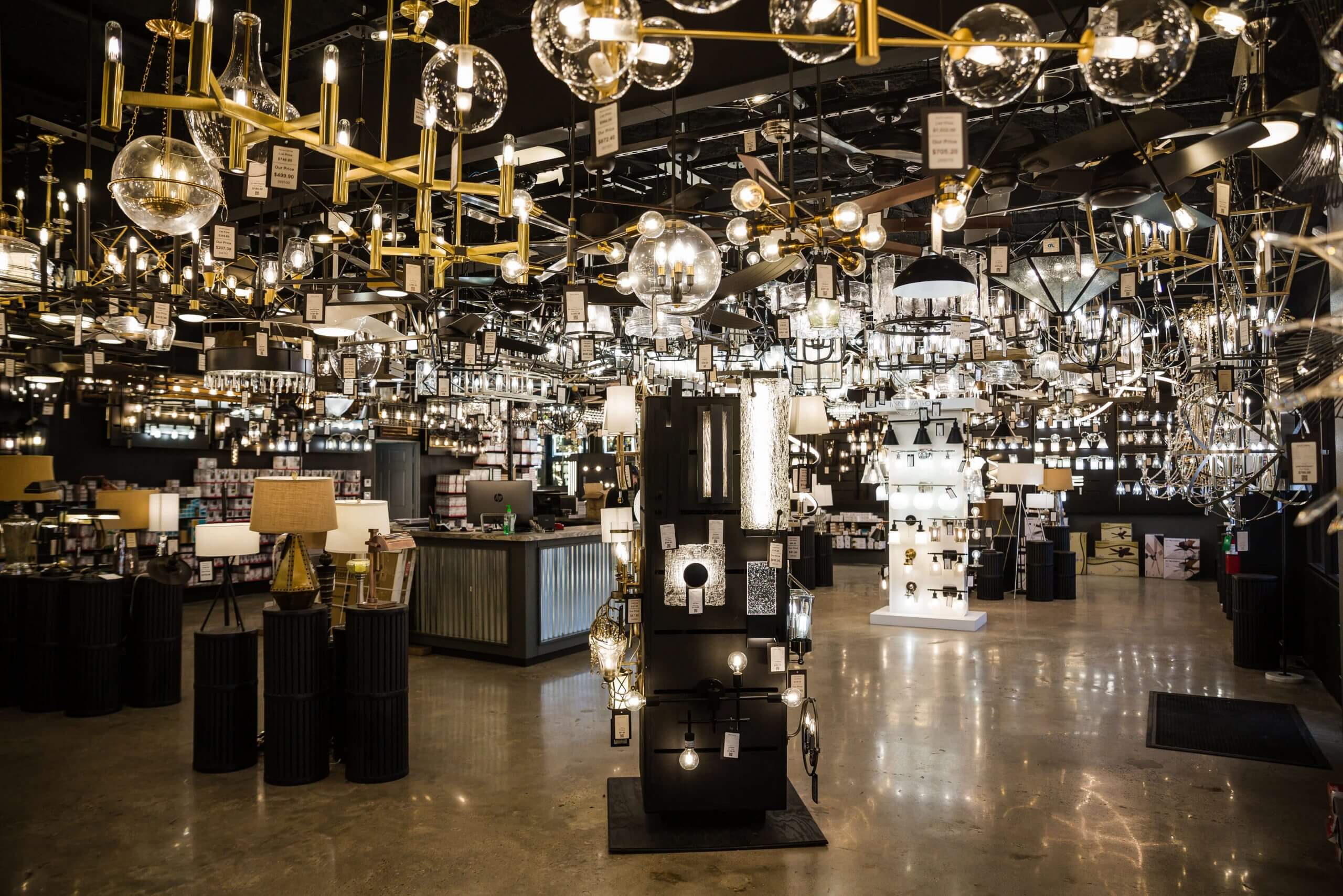 Fixture displays lit near the service counter inside the Xpress Lighting showroom